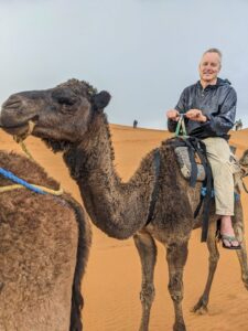 Read more about the article Day 4 — The Sahara Was Supposed to Give Us a Sunset. It Gave Us Camels and Rain Instead