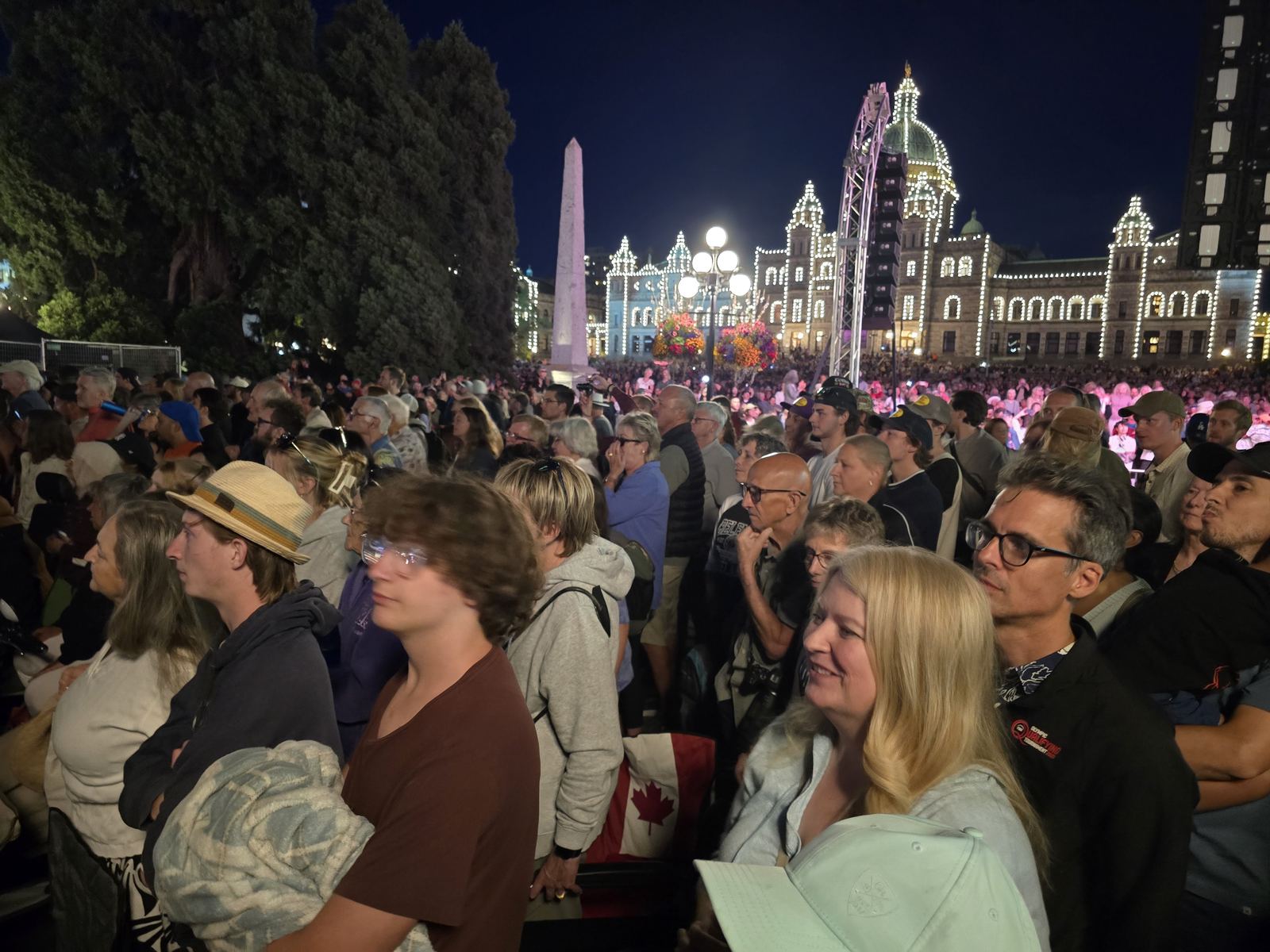 Crowd at the David Foster concert in front of the illuminated British Columbia Parliament Buildings